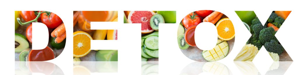 close up of fresh juice glass and fruits on table